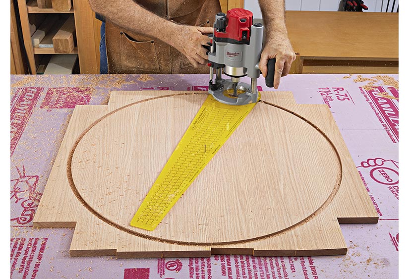 Routing a circle into surface of board with a template.