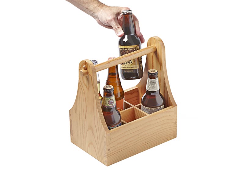 Wooden box container with rod handle that can hold 6 beers or other items.