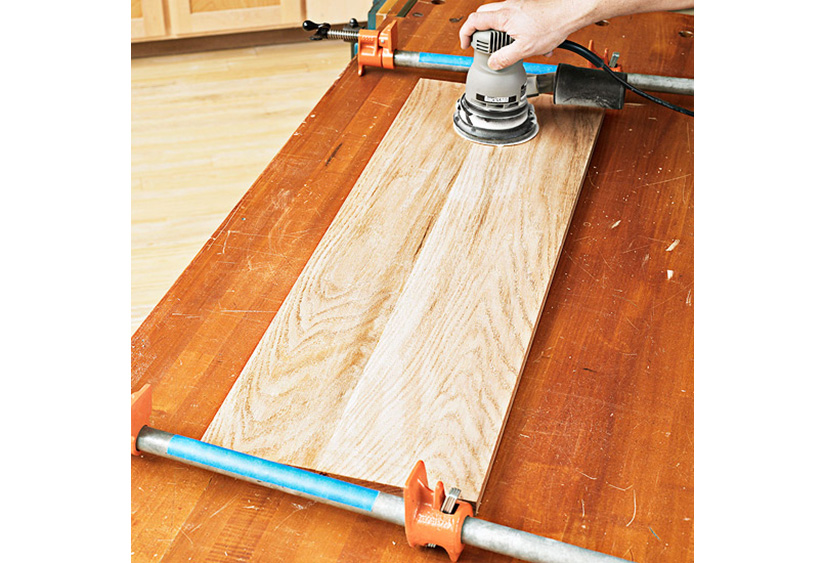 Board w/blue clamps and sander